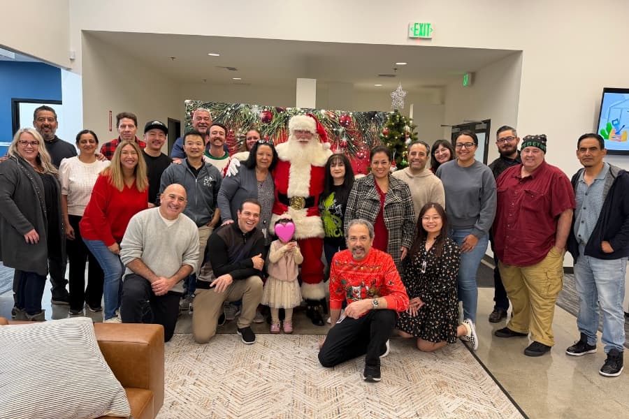 Paramount Village, PG team poses with Santa