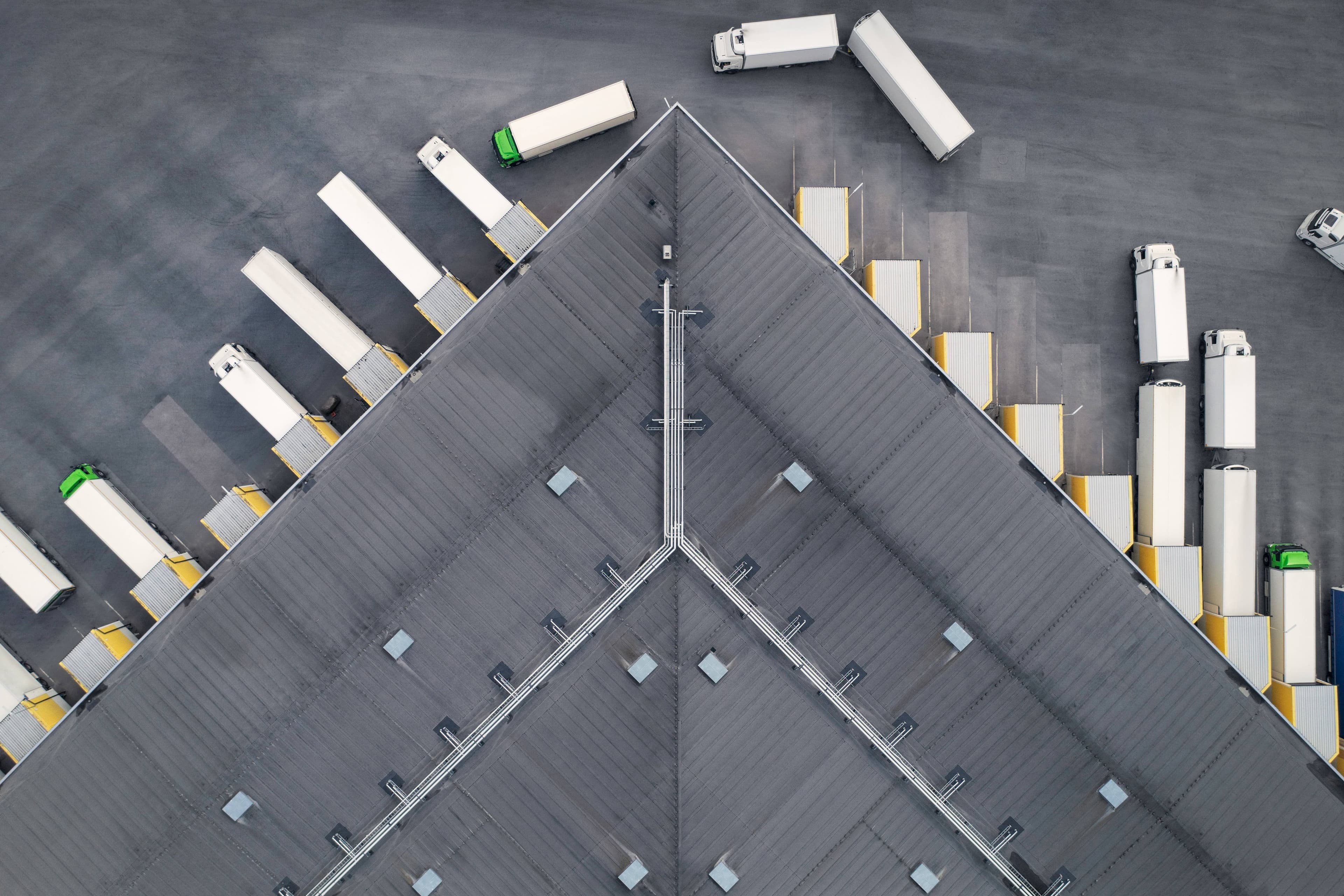 Aerial view of trucks and a warehouse