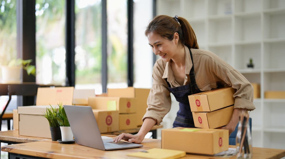 business owner packaging orders for shipping