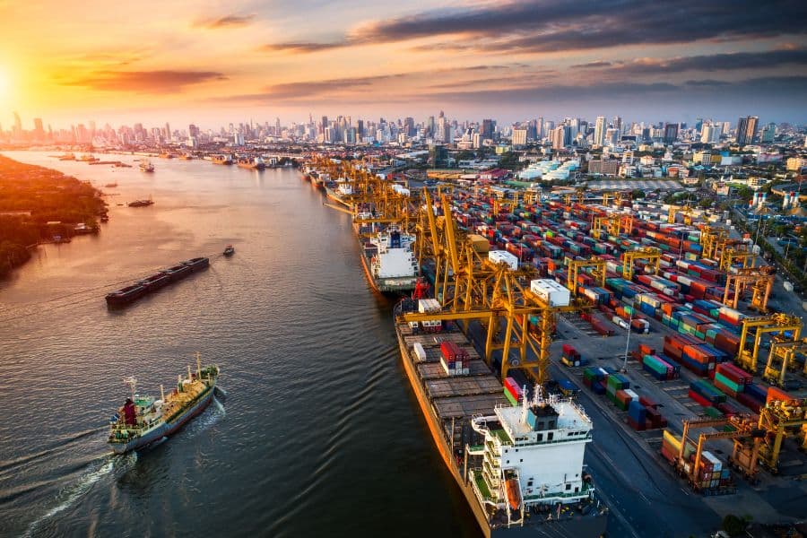 containers of products arriving at the port on their way through the supply chain