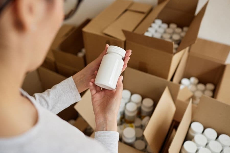 person examining wholesale bottle packaging