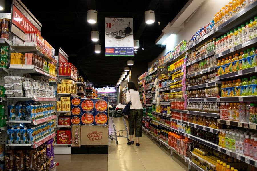 various sizes of packaging on grocery store shelves