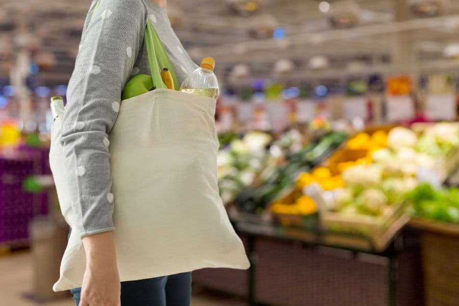 Shopper buying food and beverages in the supermarket