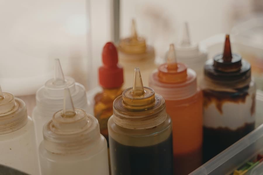 Variety of condiments in clear squeeze bottles