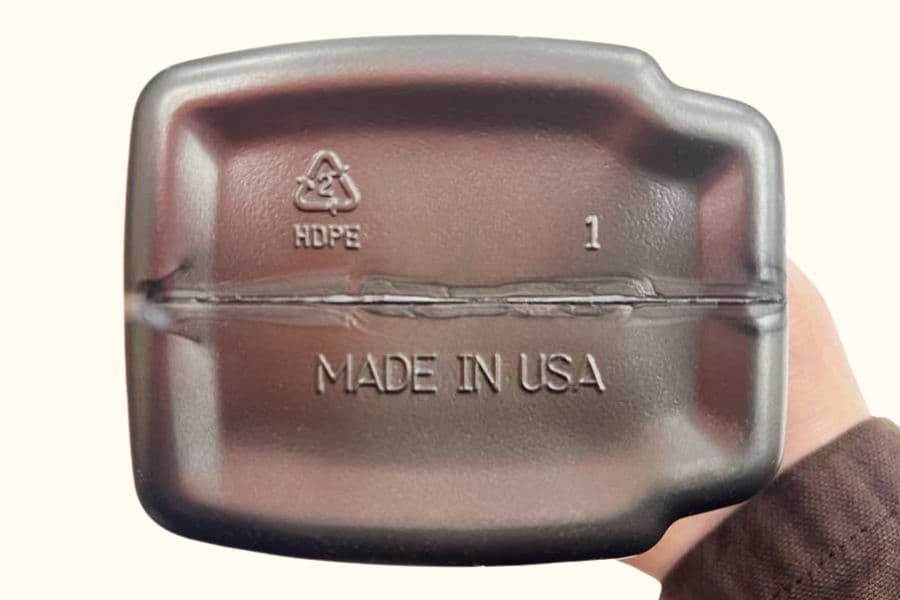 HDPE plastic bottle with resin code number 2 identifier inside the chasing arrows symbol